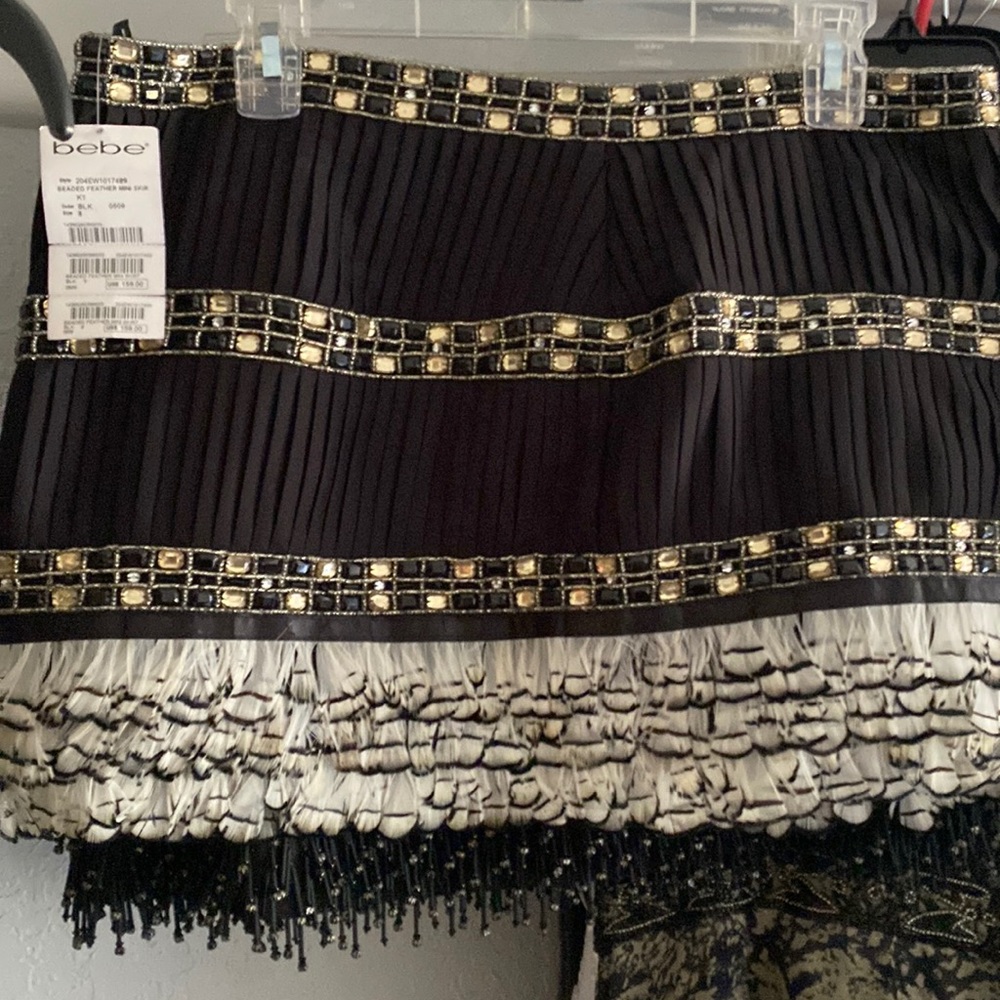 Beaded and feathered fancy mini skirt by Bebe